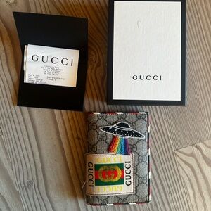 Gucci Passport Case with graphics patches; sold out worldwide